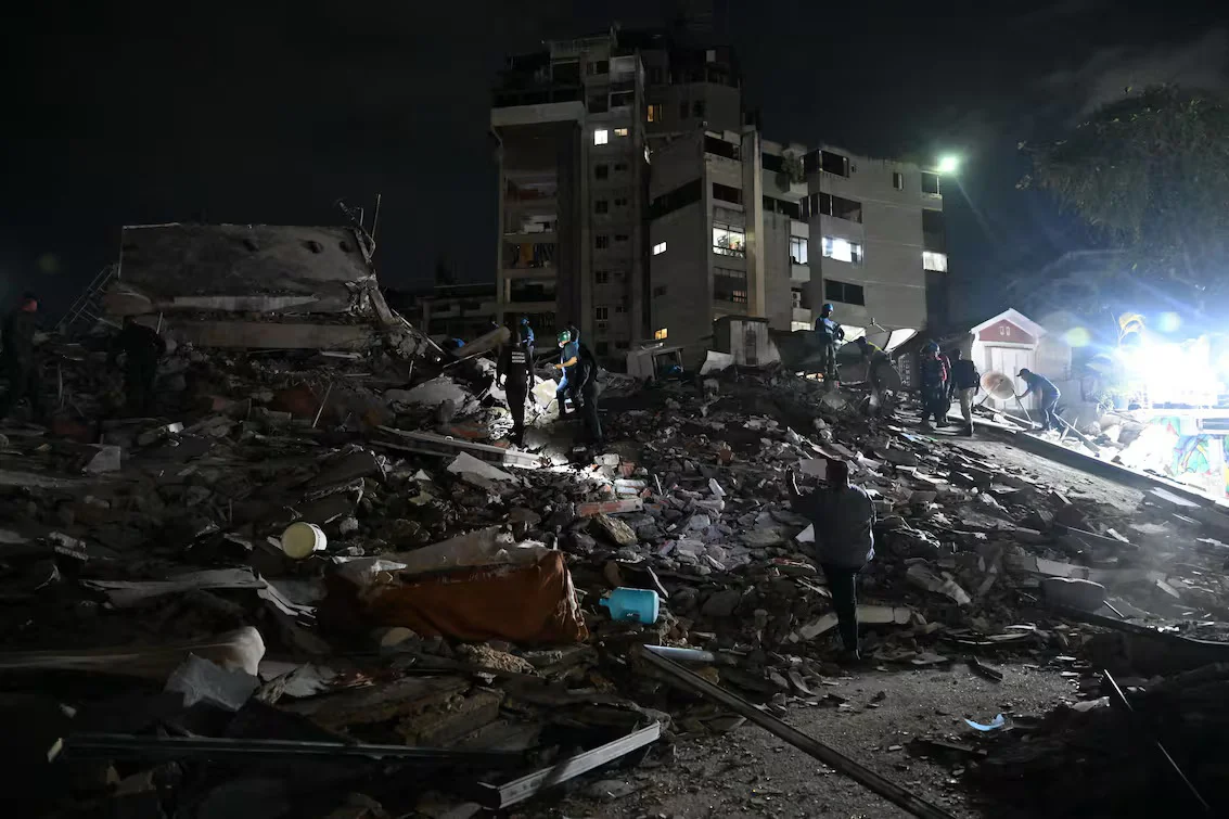 rescuers-search-through-the-rubble-of-a-collapsed-UALQYWYCJVEING3GXWGWARX6LI